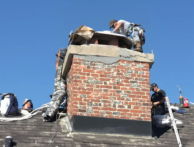 Rowland Heights Chimney Sweep installing a custom chimney crown in Rowland Heights, CA